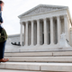 A man walks up the steps on the first day of a new term at the US Supreme Court in Washington, DC, October 7, 2019